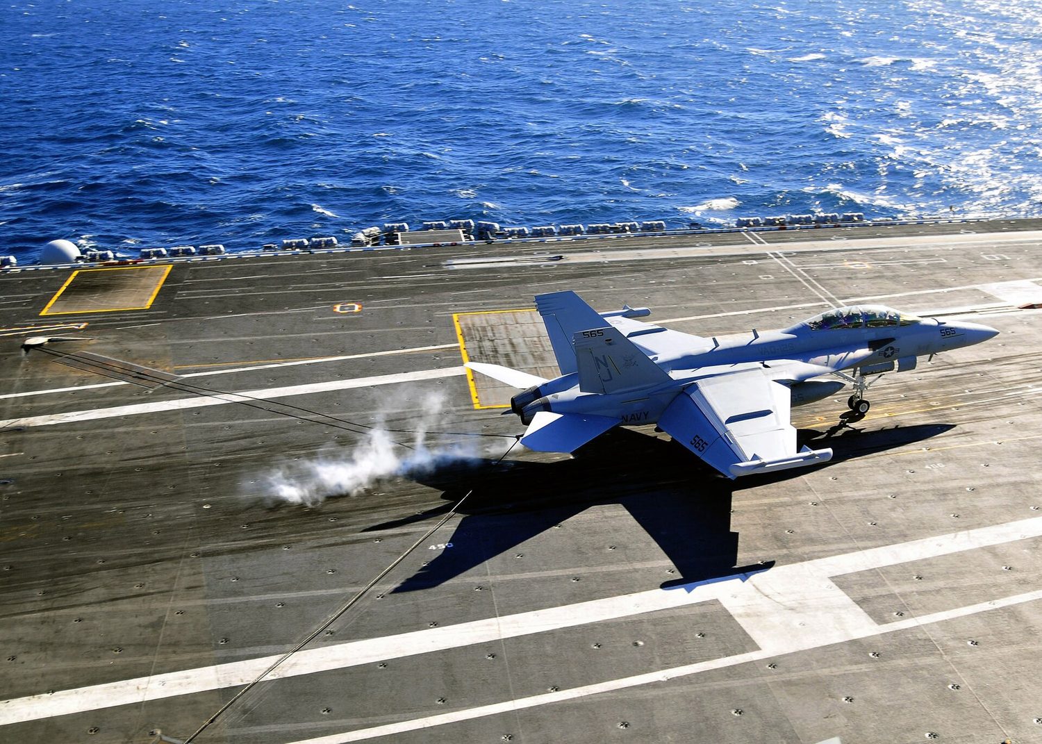 An aircraft launches from the flight deck of USS Carl Vinson.